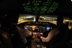 a group of pilots in a cockpit