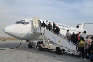 a group of people boarding an airplane