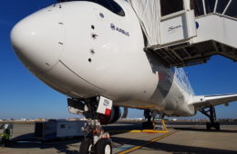 a white airplane with a door open