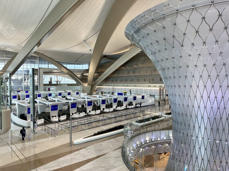 a large glass structure with rows of computers