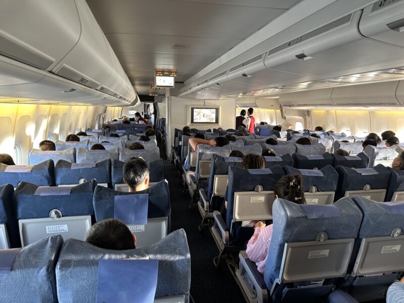 a group of people sitting in an airplane