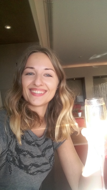 a woman holding a glass of champagne