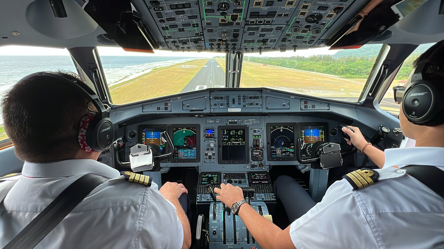 two men in a cockpit of an airplane