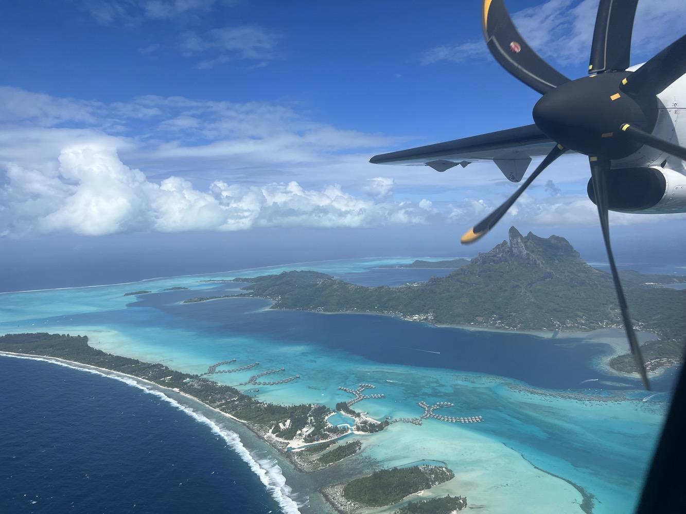 an airplane flying over an island