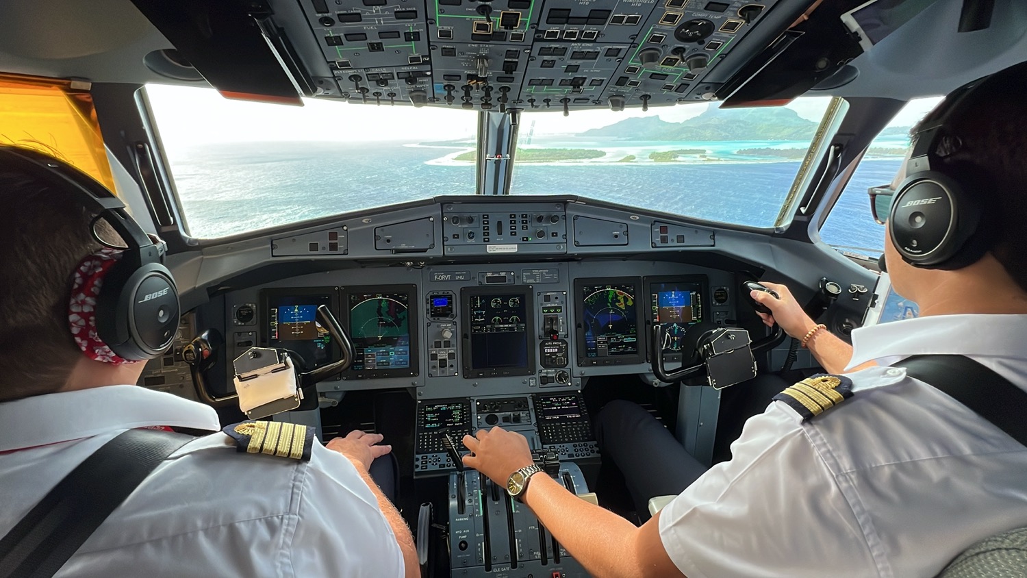 two men in a cockpit of an airplane