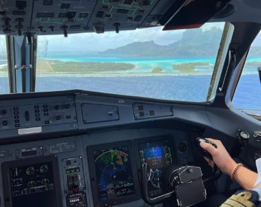 a person in a cockpit of an airplane