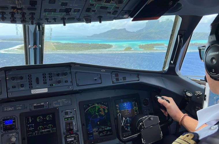 a person in a cockpit of an airplane