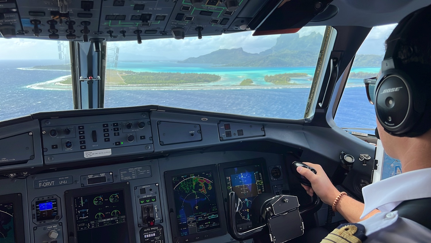 a person in a cockpit of an airplane