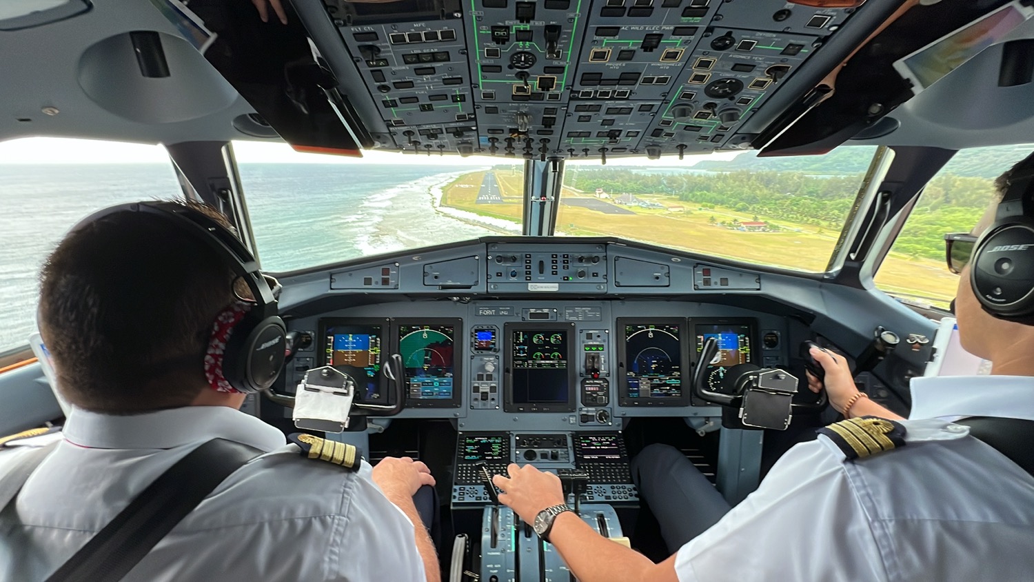 a group of people in a cockpit of an airplane