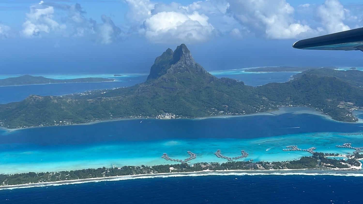 an island with a body of water and Bora Bora