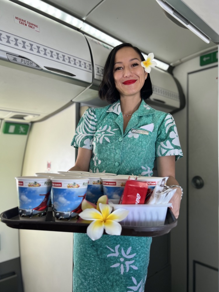 a woman holding a tray of food