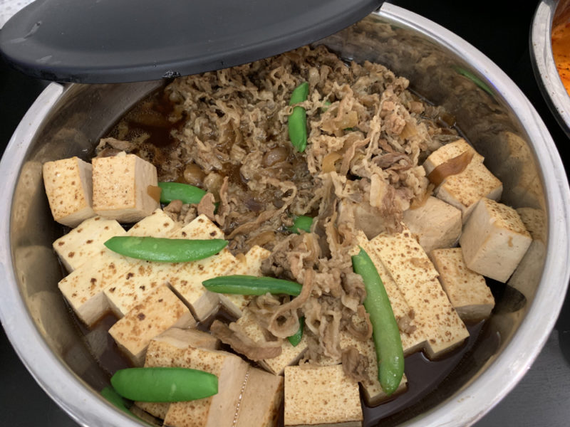 a bowl of food with a lid