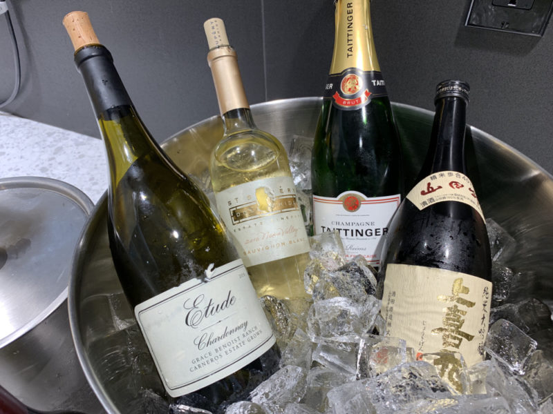 a group of bottles in a bucket of ice