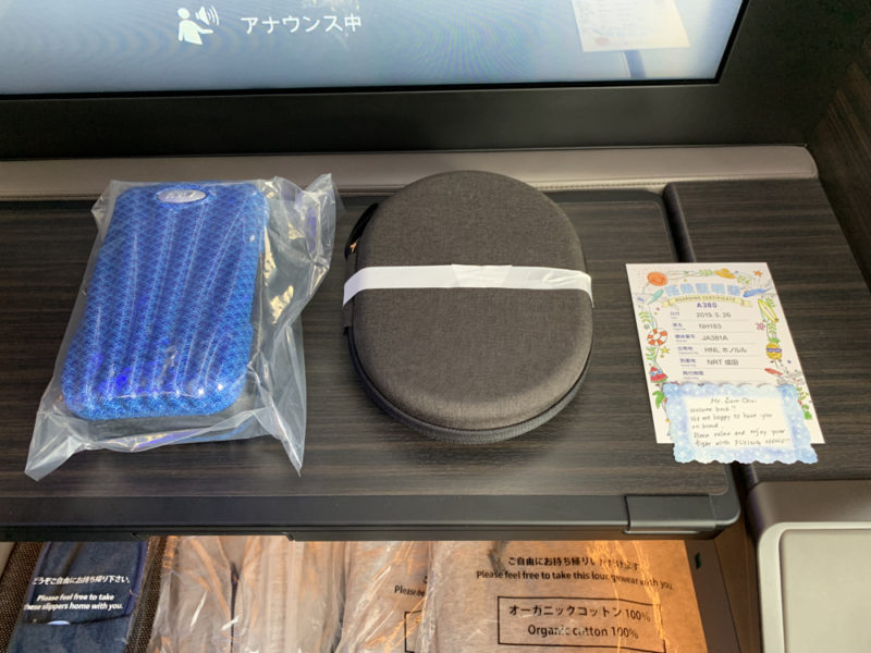 a bag of blue and white items on a table