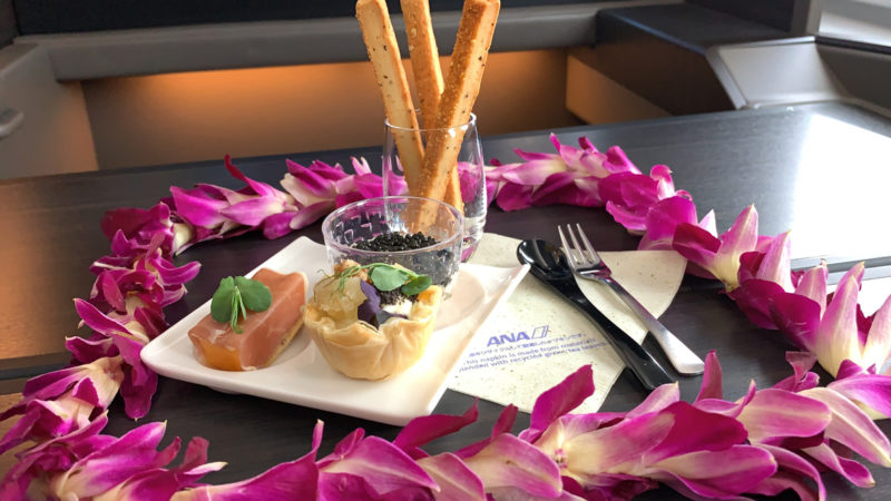 a plate with food on it and flowers around it