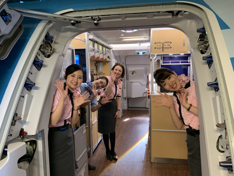 a group of women in uniform standing in a vehicle