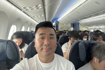 a man taking a selfie in an airplane