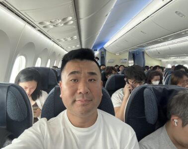 a man taking a selfie in an airplane