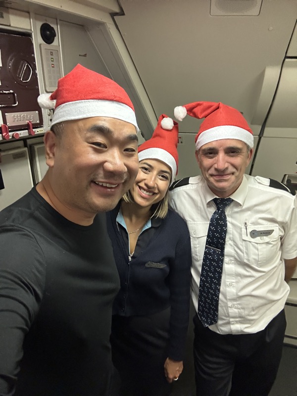 a group of people wearing santa hats