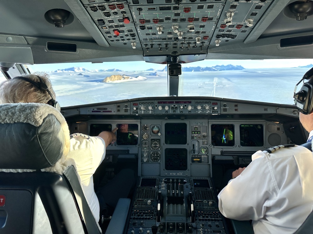 people in the cockpit of an airplane