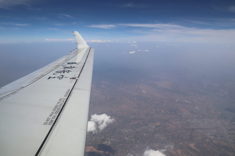 an airplane wing in the sky