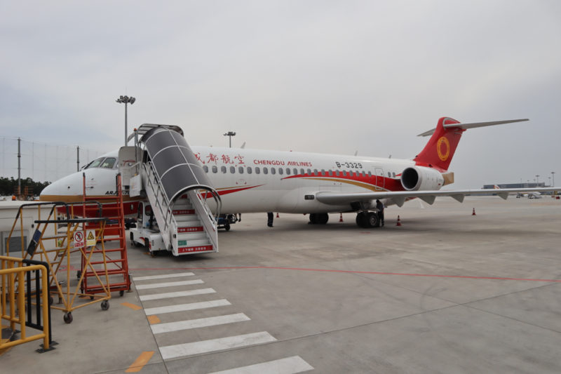 a plane with stairs on the ground