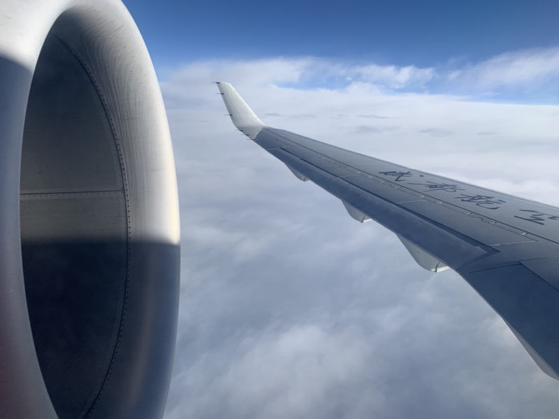 an airplane wing in the sky