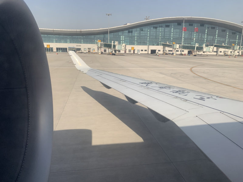 an airplane wing on a runway