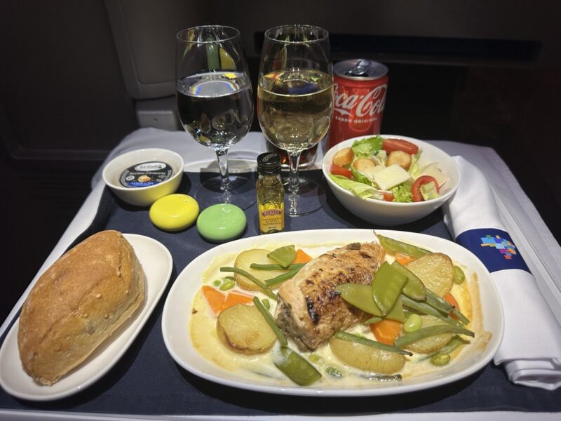 a plate of food and drinks on a tray