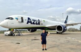 a man standing in front of an airplane