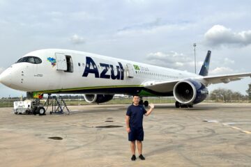 a man standing in front of an airplane