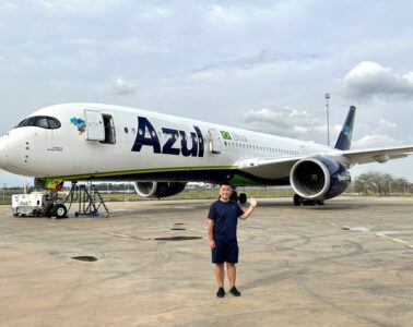 a man standing in front of an airplane