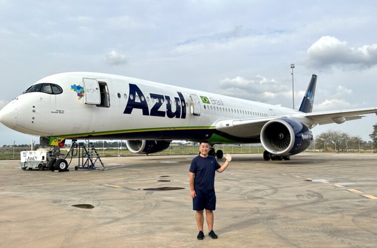 a man standing in front of an airplane