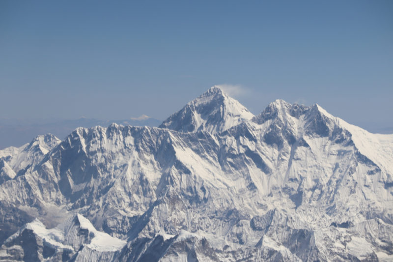 a snowy mountain with blue sky