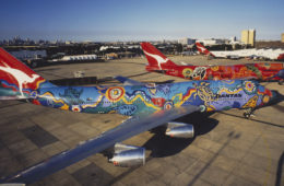 a colorful airplanes on the tarmac