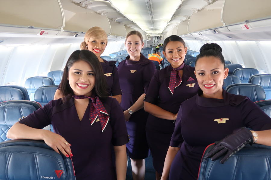 a group of women in purple uniforms