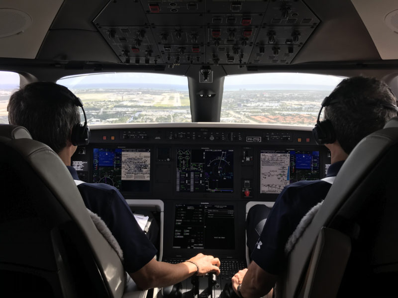 two men in the cockpit of an airplane