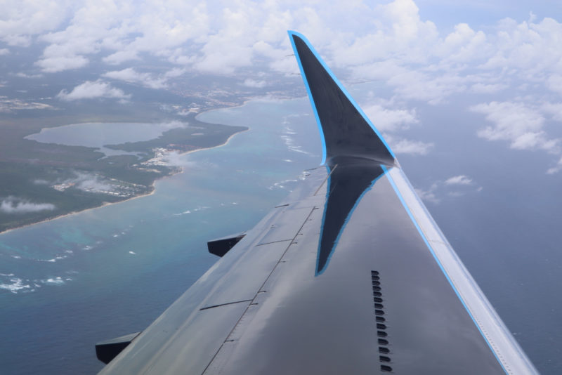 an airplane wing in the sky