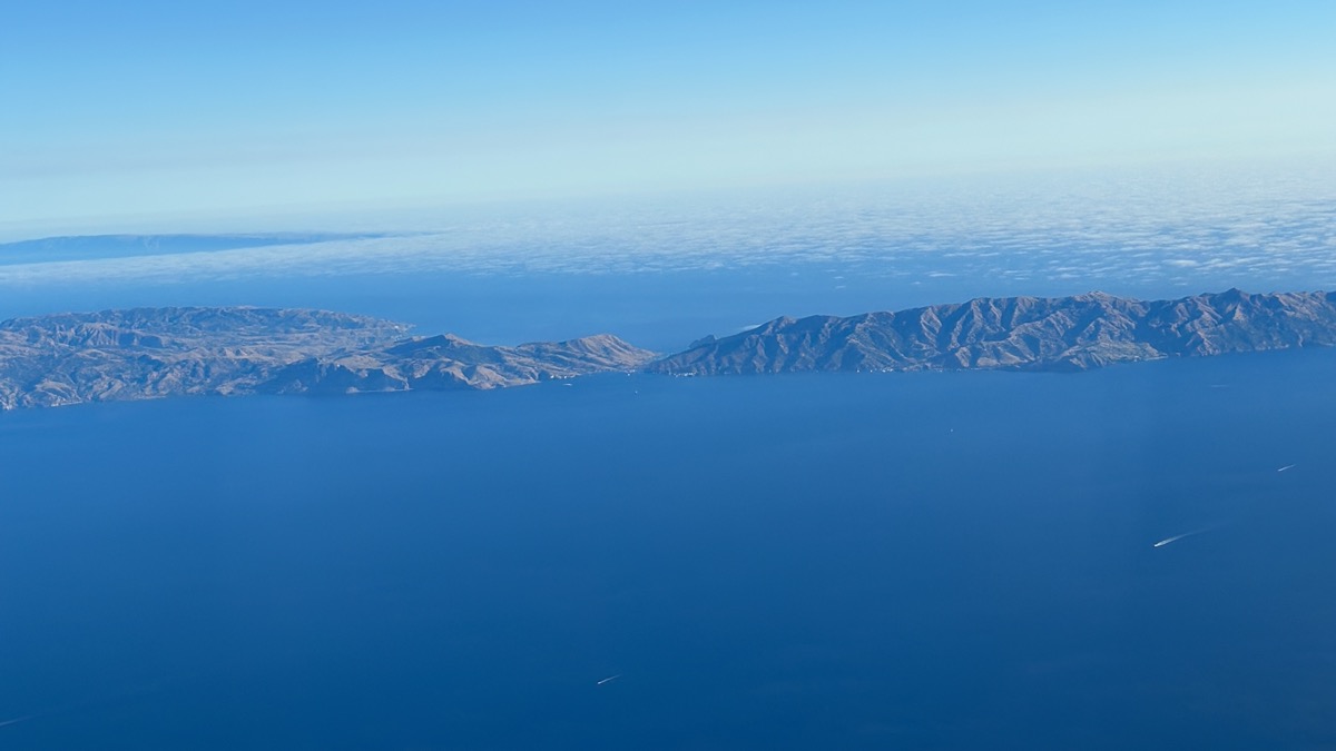 an aerial view of land and water