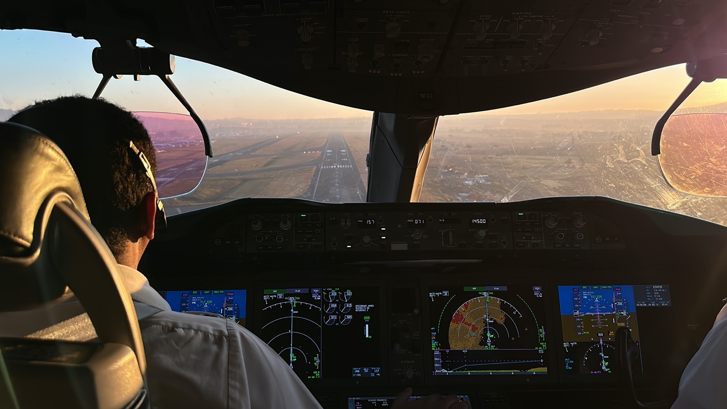 a person in a cockpit of an airplane