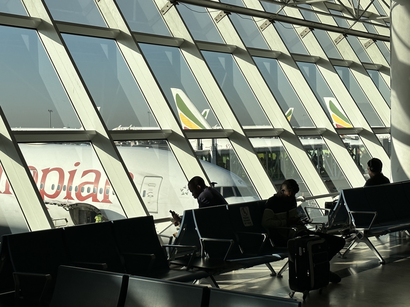 people sitting in an airport terminal