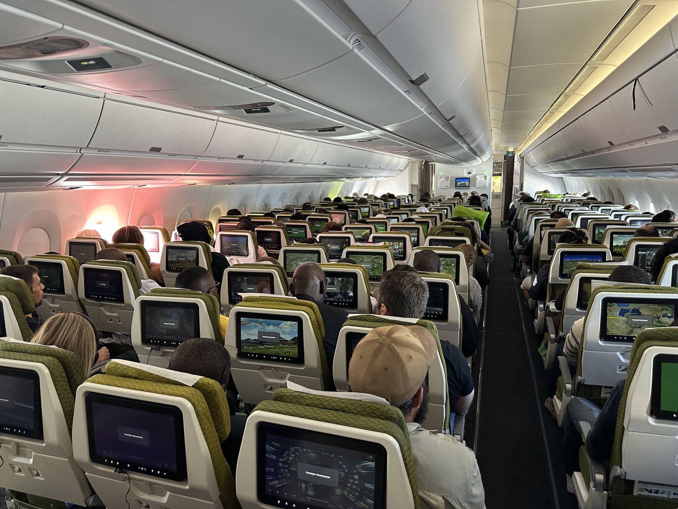 a group of people sitting in an airplane