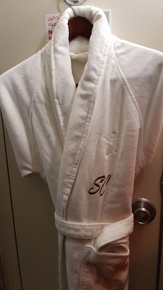 a white robe on a door