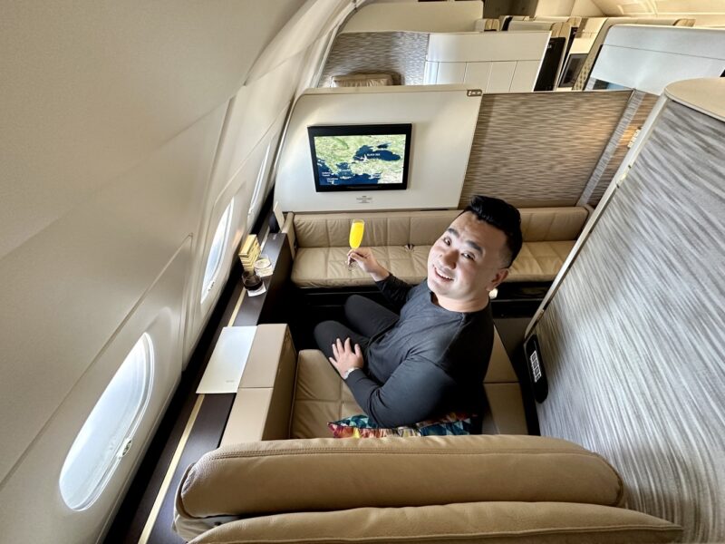 a man sitting in a chair in an airplane