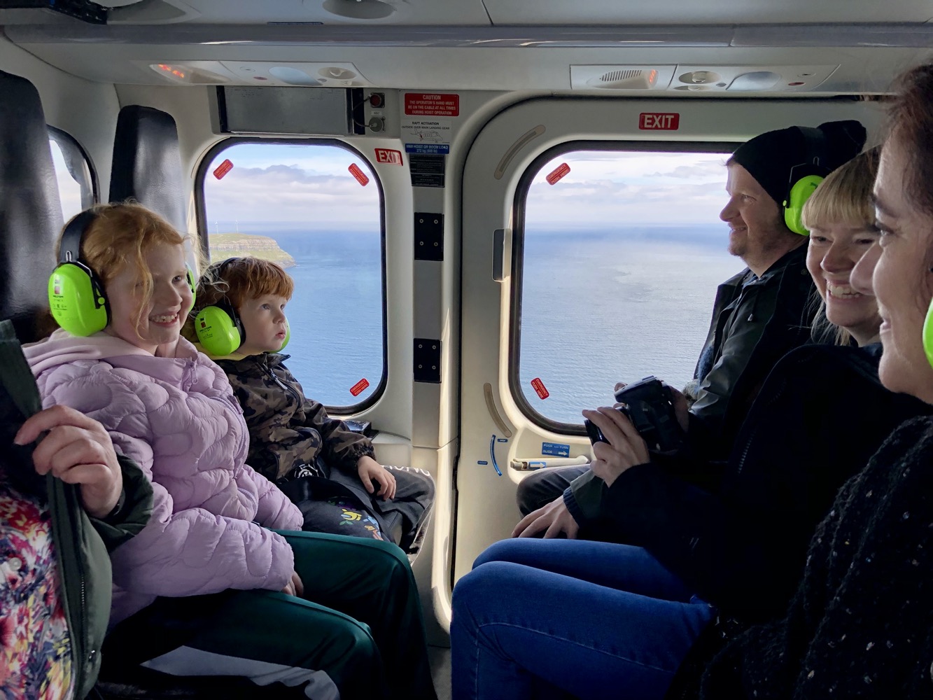 a group of people sitting in a helicopter