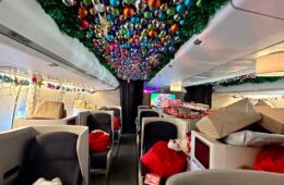 a room with christmas decorations and a ceiling