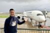 a man standing in front of a plane