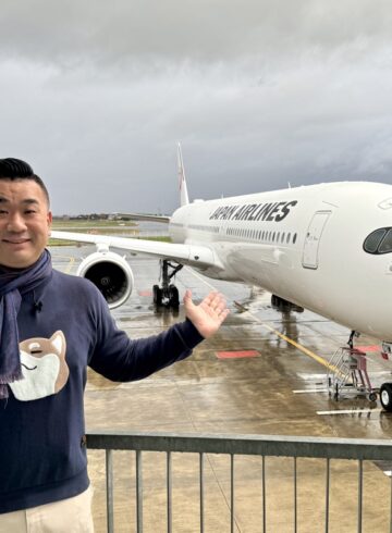 a man standing in front of a plane