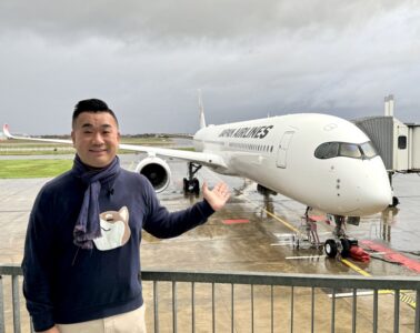 a man standing in front of a plane