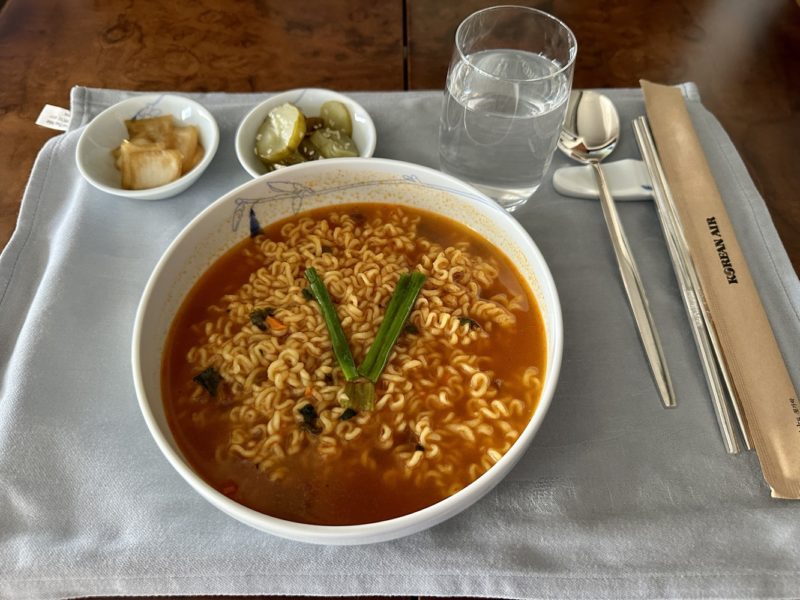 a bowl of soup with noodles and vegetables